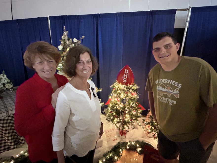 A group of people posing for a photoDescription automatically generated